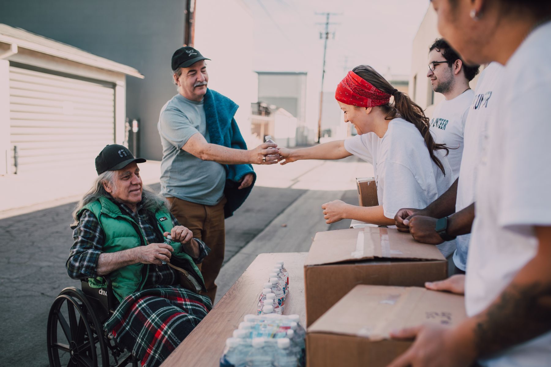 Volunteers handing out supplies at a community outreach event